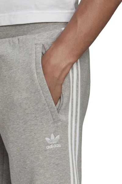 Šedé pánské tepláky Adidas 3 pruhy M GN3530