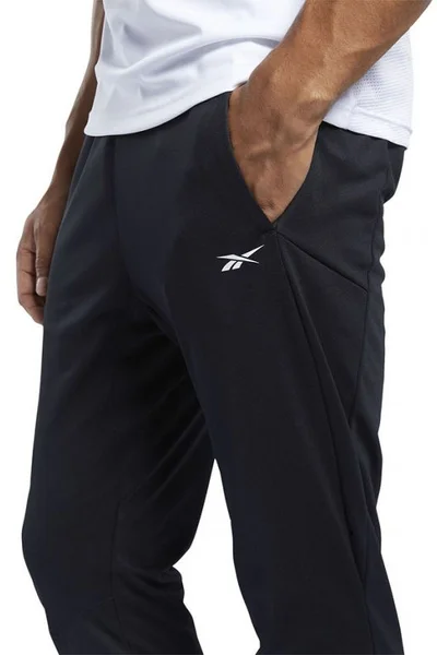 Černé pánské kalhoty Reebok Workout Knit Pant M FJ4057
