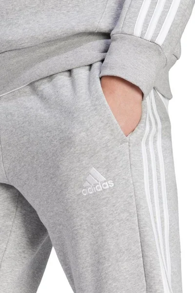 Sportovní úzké fleecové kalhoty adidas 3-Stripes šedé