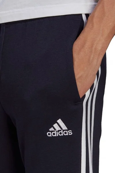Sportovní tepláky s bílými pruhy - Adidas Essentials