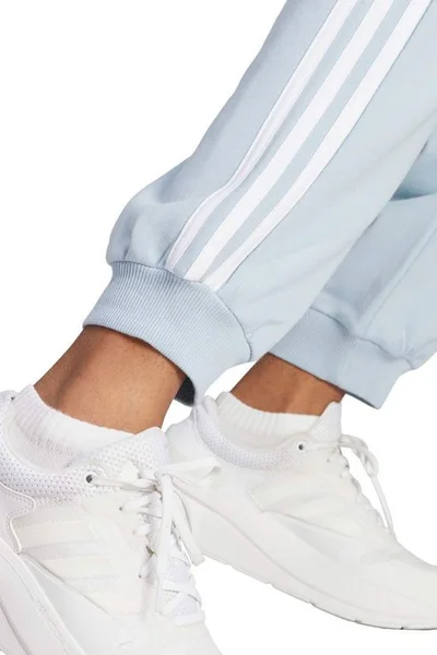 ADIDAS Dámské volné tepláky Essentials s pruhy - modré